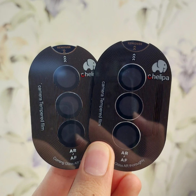 محافظ لنز دوربین شیشه ای اوجی مدل chelipa titanium مناسب برای گوشی موبایل سامسونگ Galaxy S25 محافظ لنز دوربین شیشه ای اوجی مدل chelipa titanium مناسب برای گوشی موبایل سامسونگ Galaxy S25